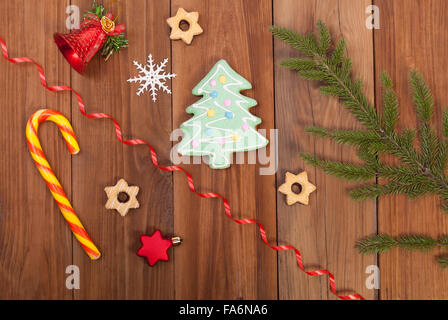 Gingerbread cookies and Christmas balls on wooden table. Stock Photo
