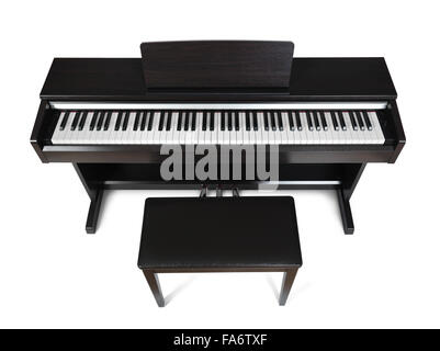 Digital piano in dark wood color high angle view isolated on white background with clipping path Stock Photo