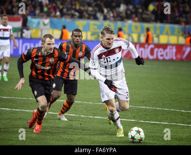 LVIV, UKRAINE - FEBRUARY 17, 2015: Bastian Schweinsteiger of Bayern Munich (R) fights for a ball with Shakhtar Donetsk players d Stock Photo