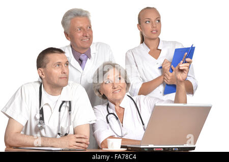 Doctors discussing at table Stock Photo
