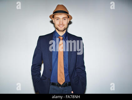 Handsome well-dressed man looking at camera Stock Photo