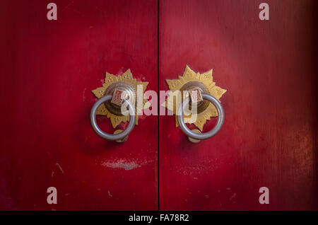 Traditional Chinese doors and door knockers, often found in old temples in China. Stock Photo