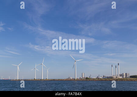 Photograph of wind power plants and industrial buildings in Copenhagen, Denmark. Stock Photo