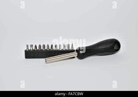 Screwdriver with twelve interchangeable bits of different shapes Stock Photo