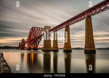Forth Railway Bridge over the Firth of Forth at sunset in Edinburgh, Scotland, United Kingdom. Long exposure.