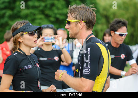 Markeaton Park, Derby, UK. 12th July 2015. Jenson Button is congratulated by his wife, Jessica Button, after finishing the Jenson Button Trust Triathlon 2015. &copy; Paul Warburton. Stock Photo