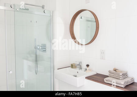 White bathroom in a modern country house in Cambridge. A house combining modern minimalist style with display of traditional objects used in every day life. Stock Photo