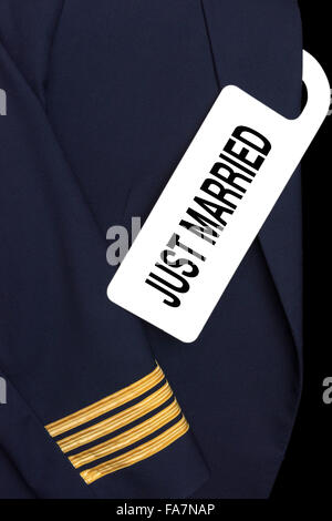 Pilot uniform with hotel room tag and caption Stock Photo