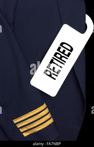 Pilot uniform with hotel room tag and caption Stock Photo