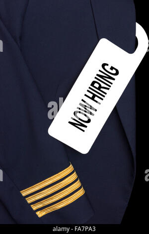 Pilot uniform with hotel room tag and caption Stock Photo