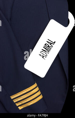 Pilot uniform with hotel room tag and caption Stock Photo