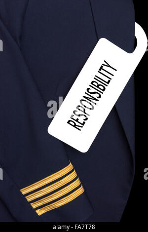 Pilot uniform with hotel room tag and caption Stock Photo