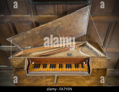 A 16th century virginal showing a detail of the inscription (and date of 1537) over the keyboard, in the Music Room at Westwood Manor, Wiltshire. Stock Photo