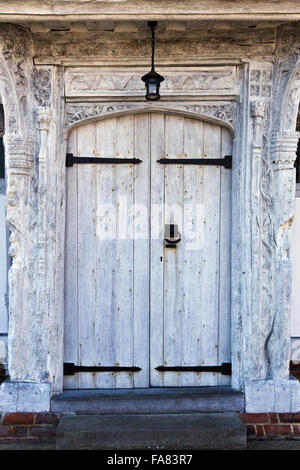 Door at the sixteenth-century Lavenham Guildhall, Suffolk. The building dates from 1529 and was originally the hall of the Guild of Corpus Christi. Stock Photo