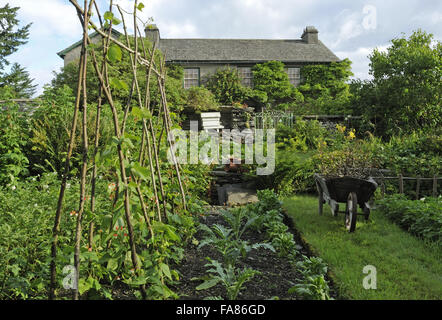 The garden in the summertime at Hill Top, Cumbria. Once the home of Beatrix Potter, Hill Top's garden is a haphazard mix of flowers, herbs, fruit and vegetables. Stock Photo