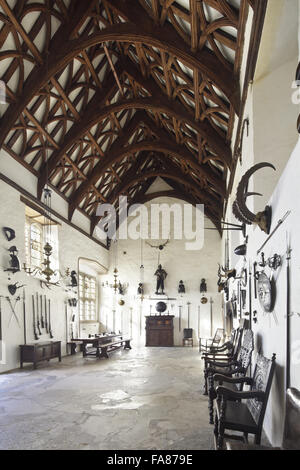 The Hall looking towards the west wall at Cotehele, Cornwall. The Hall is early sixteenth century with a timber roof supported by moulded wind-braces. Stock Photo