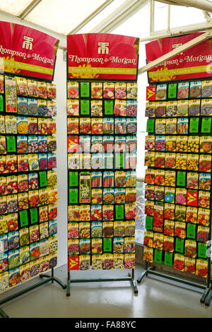 Packets of Thompson and Morgan flower seeds for sale on a display stand in a garden centre Stock Photo