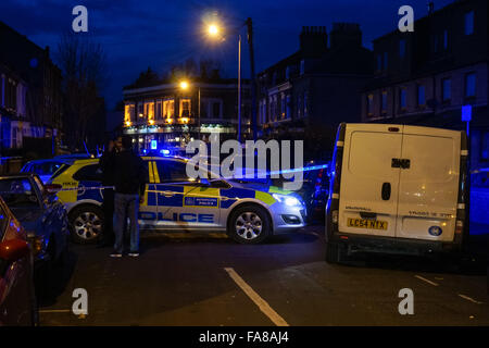 Police officers secure the crime scene after a stabbing at Langthorne Road and North Birkbeck Road in London, England United Kingdom UK Stock Photo