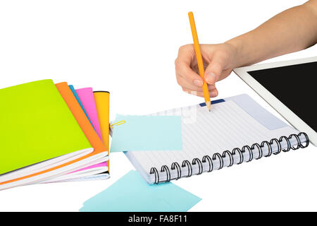 Females hand writing in notebook Stock Photo - Alamy