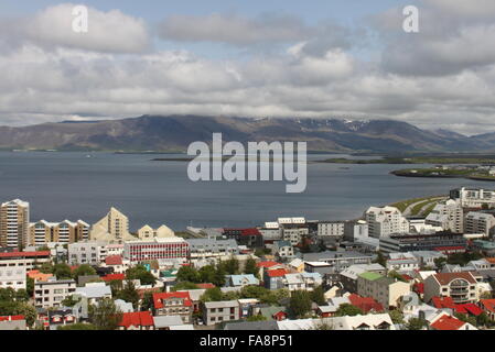 View from the observation deck of Hallgrimskirkja of buildings in central Reykjavik and the North Atlantic Ocean Iceland Europe Stock Photo