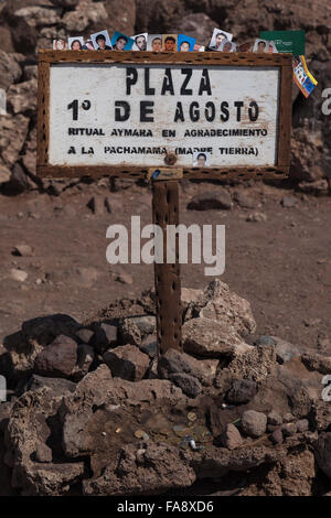 Passport photos from travellers at the offerings site of Plaza 1 de Agosto, Isla Incahuasi, Inkawasi or Inka Wasi, island in the Salar de Uyuni salt flat, Bolivian Altiplano, Boliva Stock Photo