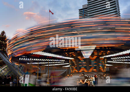 Blurred spinning merry-go-round at Toronto Christmas Market Distillery District Stock Photo