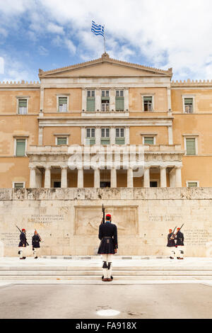 The Hellenic (Greek) Parliament in Athens, with the Presidential Guards,called Evzones, in front. Athens, Greece Stock Photo