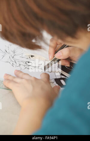 Japanese Manga artist working in the studio Stock Photo