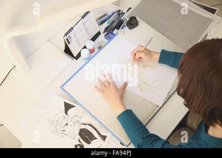 Japanese Manga artist working in the studio Stock Photo