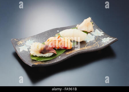 Sushi plate on black desk Stock Photo