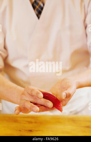 Japanese sushi chef working Stock Photo