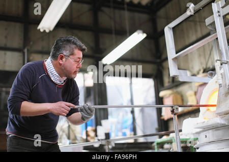 Japanese glass artisan working in the studio Stock Photo