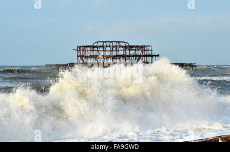 Brighton Sussex UK 24th December 2015 - Waves pound on to the beach near Brighton's West Pier as Storm Eva hits Britain with gales and winds blowing with gusts of up to 80mph Stock Photo