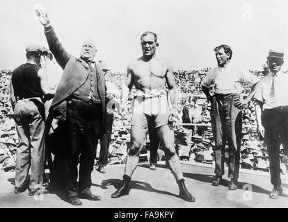 Vintage photo of American boxer James J Jeffries being introduced to the crowd prior to the famous “Fight of the Century” with Jack Johnson for the World Heavyweight Championship. The bout took place at Reno, Nevada, on July 4 1910 and Jeffries was soundly beaten – the fight was stopped in the 15th round after Jeffries was knocked down for the first time in his career. The previously undefeated Jeffries (1875 – 1953), nicknamed “The Boilermaker”, had come out of retirement for the fight, having previously held the world heavyweight crown from 1899 to 1905.