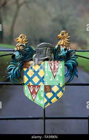 Heraldic coat of arms on the Manor House hotel gates. Castle Combe, Wiltshire, England Stock Photo