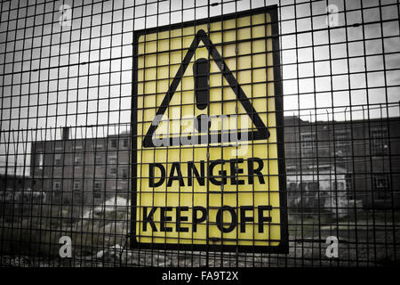 Danger keep out sign on a metal fence Stock Photo