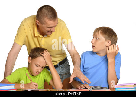 Father helping kids with homework Stock Photo