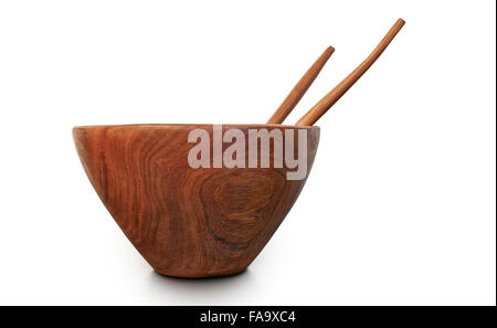 Kitchen utensils: empty wooden bowl with spoon and fork isolated on white background - clipping path Stock Photo