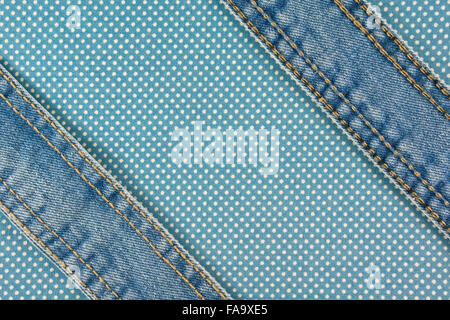 Jeans with stitch on blue dot cloth texture and background Stock Photo