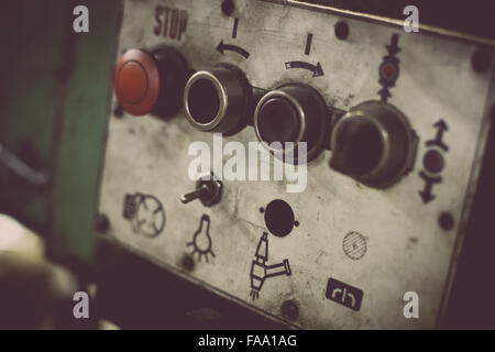 Color image of some buttons on a dirty old control panel. Stock Photo