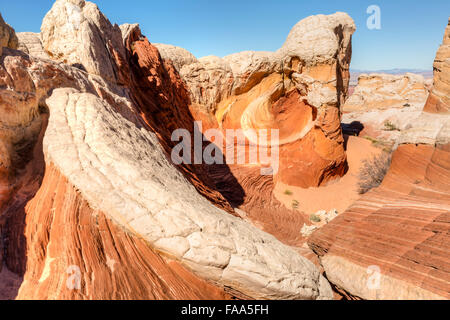 A multi-colored rock formation called 'The Vortex' in the unique White Pocket rock formations in Vermillion Cliffs N.M. Stock Photo