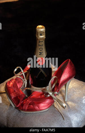 Christmas celebration with Moet Champagne and Red High heel shoes Stock Photo