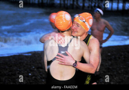 Brighton Sussex UK 25th December 2015 - Members of Brighton Swimming Club were out at 7am to catch the tide this morning for their annual Christmas Day Swim by the pier . Brighton Swimming Club is the oldest in England and they have been swimming in the sea since 1860 Credit:  Simon Dack/Alamy Live News Stock Photo