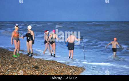 Brighton Sussex UK 25th December 2015 - Members of Brighton Swimming Club were out at 7am to catch the tide this morning for their annual Christmas Day Swim by the pier . Brighton Swimming Club is the oldest in England and they have been swimming in the sea since 1860 Credit:  Simon Dack/Alamy Live News Stock Photo