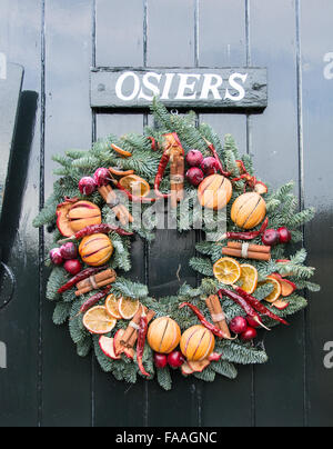 A colourful festive Christmas wreath on an English front door Stock Photo