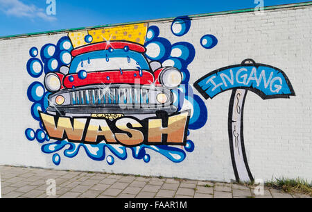 ZWOLLE, NETHERLANDS - MARCH 22, 2015: Colorful graffiti advertisement at the entrance of a car wash station Stock Photo