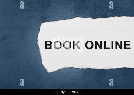 book online with white paper tears on blue texture Stock Photo