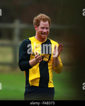 Castle Rising, Norfolk, UK.  24th December, 2015.  HRH Prince Harry (of Wales), takes part in an annual charity football match involving estate workers from Sandringham.  Credit:  Paul Marriott/Alamy Live News Stock Photo