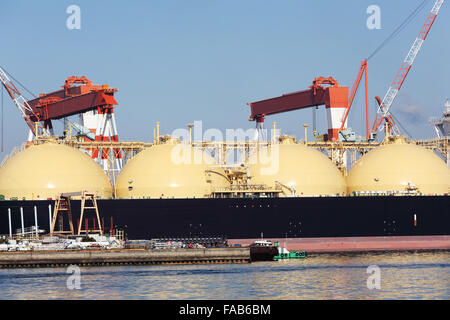 Lng cargo ship docked in the port Stock Photo