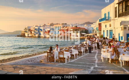Outdoor restaurant, Mykonos Island Old Town, Little Venice in the background, Greece Stock Photo